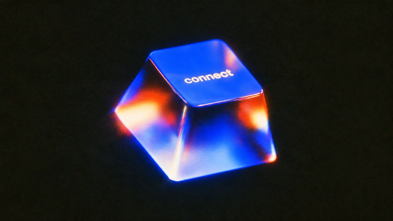 Grainy film still of a glass keyboard key labelled connect, glowing cobalt blue with hot orange light refracting through its sides in the dark